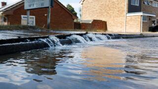A new water leak flooding the road on Ladysmith Road, Cheltenham. 23rd July 2018
