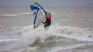 Herbrand Walk, Cooden. 31st December 2024. Gale force winds built along the south coast this afternoon prior to a Met Office yellow warning for wind for New Year's Day. Windsurfers braving the weather off Cooden Beach near Eastbourne in East Sussex. Credi