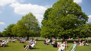 People enjoy a sunny May day in Hyde Park, London