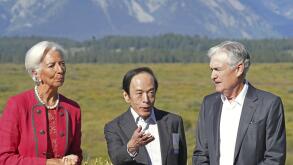 Bank of Japan Governor Kazuo Ueda (C) chats with U.S. Federal Reserve Chair Jerome Powell (R) at a villa used for an economic symposium in Jackson Hole, Wyoming, on Aug. 25, 2023. Standing next to Ueda is European Central Bank President Christine Lagarde.