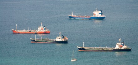 Cargo ships at anchor in front of Gibraltar