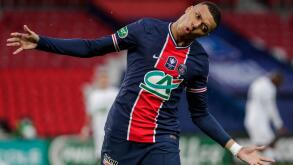 PSG's Kylian Mbappe celebrates after scoring his team second goal during the French Cup soccer match between PSG and Lille at the Parc des Princes stadium in Paris, France, Wednesday, March 17, 2021. (AP Photo/Thibault Camus)