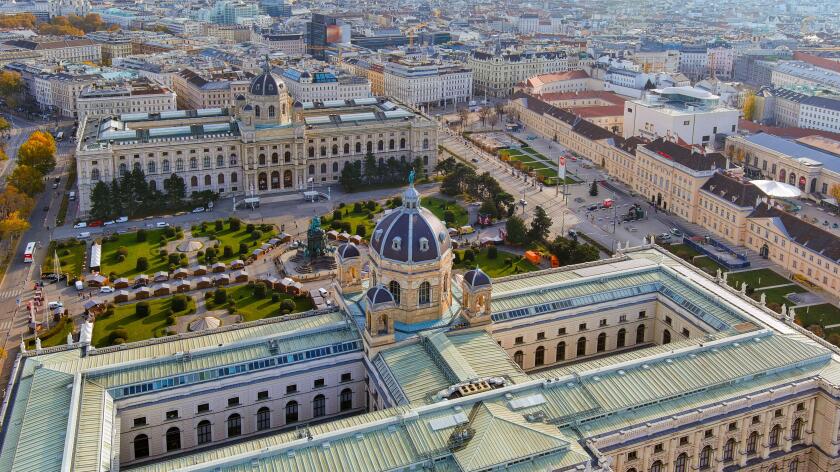 A magnificent aerial shot of Vienna?s MuseumsQuartier, featuring the Kunsthistorisches Museum and lush gardens, showcasing architectural brilliance an