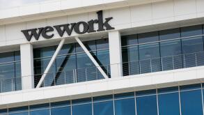 A logo sign outside of a WeWork office building in Lehi, Utah on July 27, 2019.