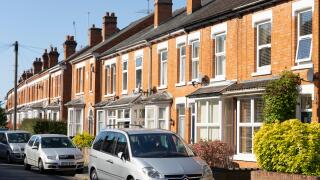 Terraced brick housing, concept - the UK housing market, economy, house prices, renting, mortgages, rental market, letting, landlords