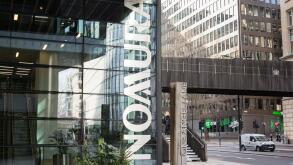 Signage outside Nomura International Plc, One Angel Lane, Bishopsgate, City of London, EC4, England, U.K.