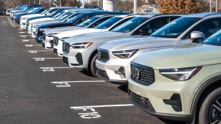New Volvo vehicles lined up for sale at a dealership