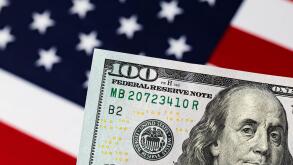 100 dollar bill with American flag. Debt ceiling, stock market and financial concept.