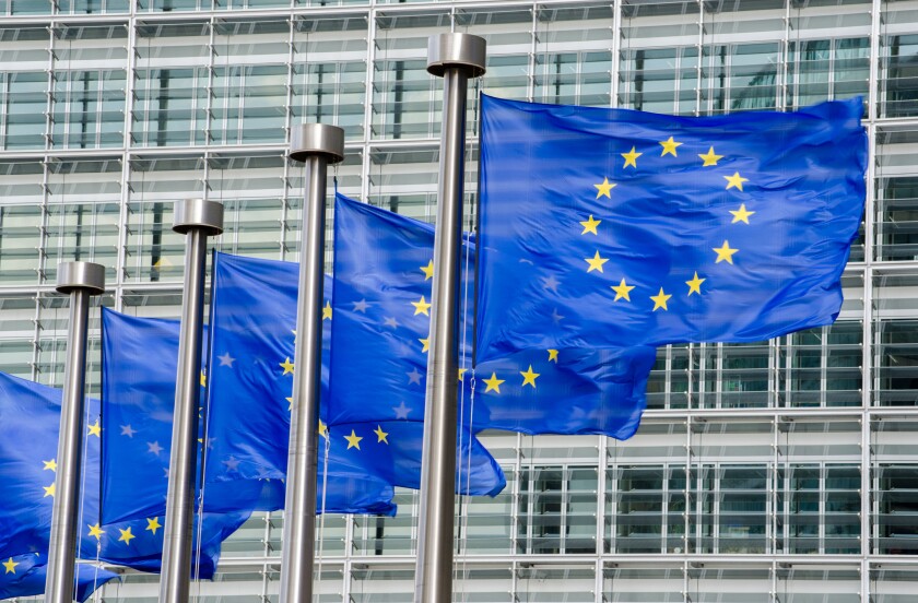 EU flags in front of European Commission in Brussels
