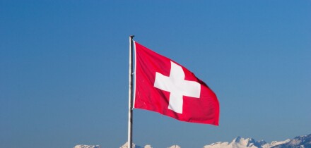 Swiss flag and Alps
