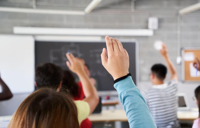 School classroom hands-up_4Sep23_alamy