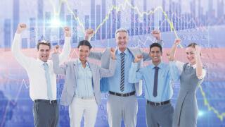 Composite image of business people cheering in office