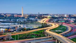 Washington, DC skyline of monuments and highways.