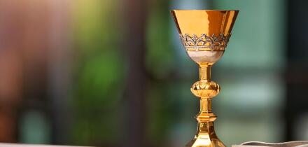 Chalice on the altar in church and empty space for text