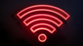 AI-generated neon red wi-fi symbol on dark background