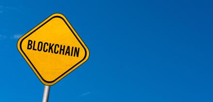 Blockchain - yellow sign with blue sky