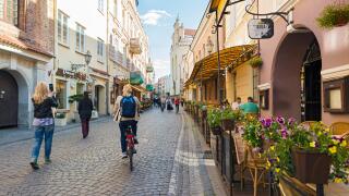 VILNIUS, LITHUANIA - JUNE 7, 2016: Unidentified people walk in the historic center of the city on a sunny spring day