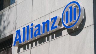 Lugano, Switzerland - 30th March 2021 : Allianz company sign hanging on building in Lugano. Allianz is a German multinational financial services compa