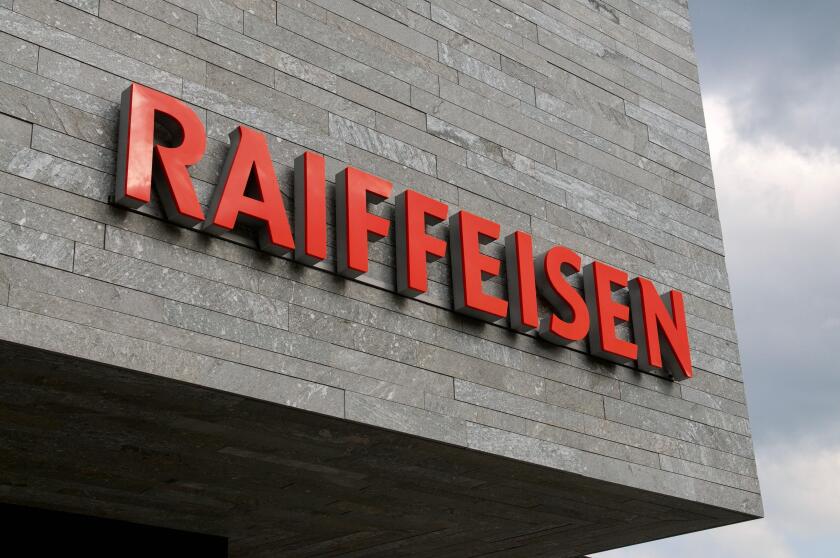 Wohlen, Aargau, Switzerland - 15th April 2021 : Swiss Raiffeisen bank sign on a concrete facade in Wohlen. Raiffeisen is a Swiss cooperative bank, the