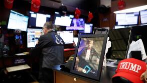 New York, United States. 03rd Apr, 2025. Trump Maga merchandise is present on the floor of the New York Stock Exchange as traders work on Wall Street on Thursday, April 3, 2025 in New York City. The Dow Jones Industrial Average opened today down over 1000