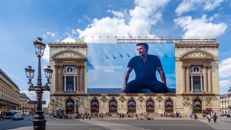 Advertising billboard for the Beckham - Boss clothing collection, by Hugo Boss, over the restoration works on the main facade of the Paris Opera house