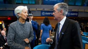 International Monetary Fund (IMF) Managing Director Christine Lagarde speaks with Federal Reserve Board Chair Jerome Powell during the International Monetary and Financial Committee meeting, at the World Bank/IMF Spring Meetings in Washington, Saturday, A