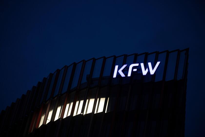PRODUCTION - 20 October 2021, Hessen, Frankfurt/Main: A light is burning at the Kreditanstalt fur Wiederaufbau (KFW) under its logo. The coalition negotiations to form a government after the Bundestag elections begin today. Photo: Sebastian Gollnow/dpa