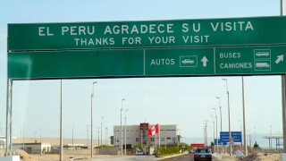 Tacna Peru,Pan American Highway,approaching Chile,land border,crossing point,checkpoint,highway,sign,bilingual,Spanish,English,thanks for your visit,a