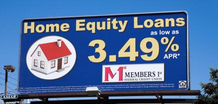 Billboard sign advertising home equity loans via Members 1st Federal Credit Union.