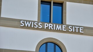 'Swiss Prime Site' sign on the side of a building in Olten, Solothurn, Switzerland.