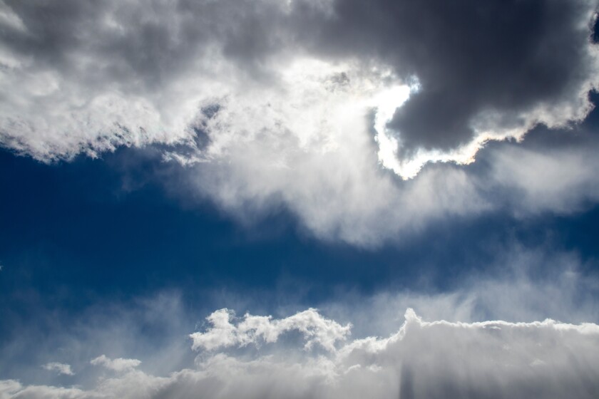 Clouds with silver lining - dark cloud lined with white in dark