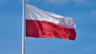 Polish flag against blue sky