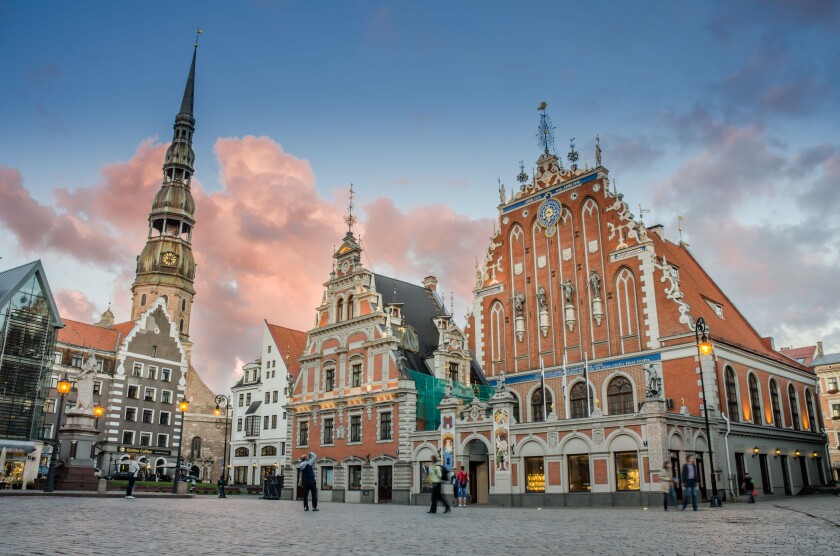 RIGA LATVIA AUG 15: evening view of the saint peter tower and blackhead house in the Old Riga on 15 august 2013