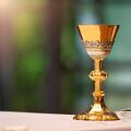 Chalice on the altar in church and empty space for text