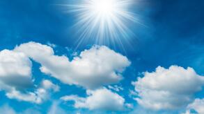 Bright shining sun with white clouds. Image shot 02/2018. Exact date unknown.