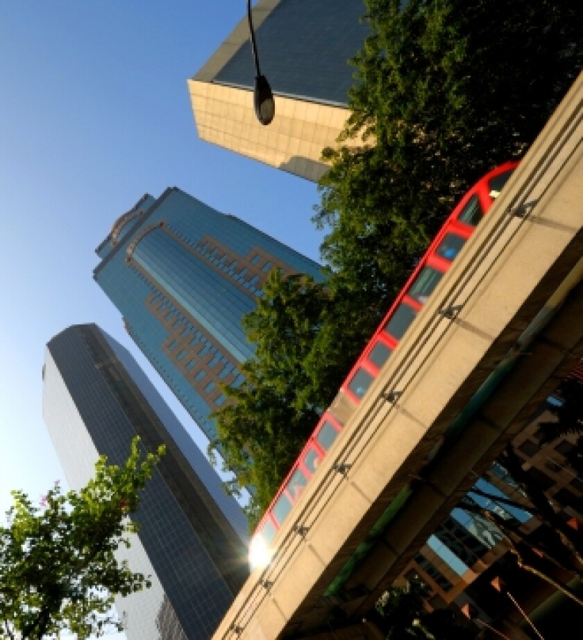 train-innercity-with-tall-buildings.jpg