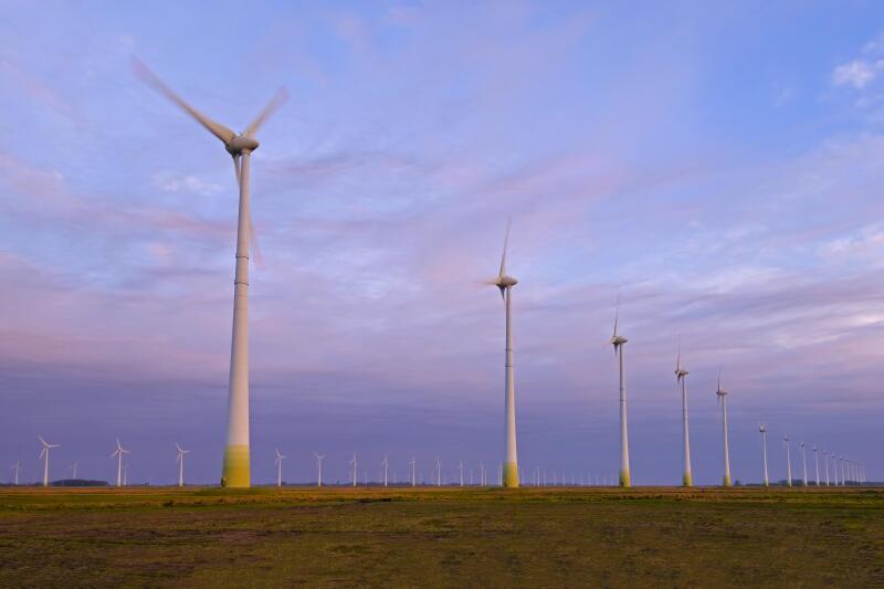 Wind turbines farm at sunset, high voltage, the future of renewable energy, Rio Grande Do Sul, Brazil