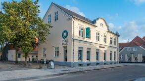 Jyske Bank Facade in Ringkobing Skjern on a sunny summer afternoon