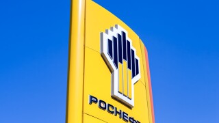 The emblem of the oil company Rosneft against the blue sky background