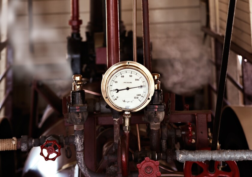 machinery under pressure gauge lets out steam