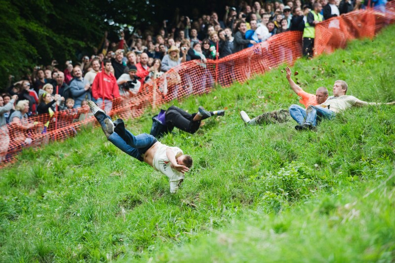 Rollover risk in action at the Cheese Rolling Festival, Cooper's Hill, Gloucestershire, UK