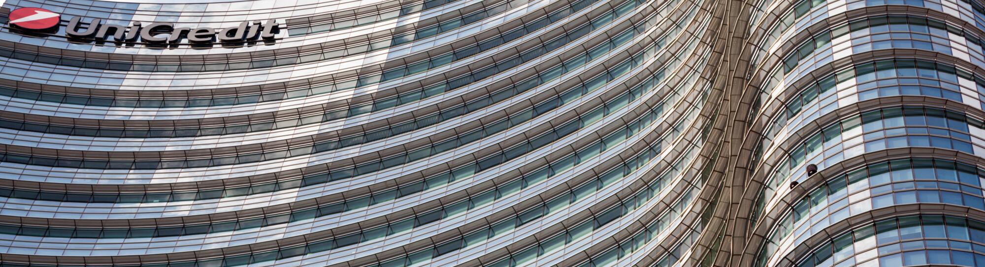 UniCredit Tower in the Porta Nuova District, Milan, Lombardy, Italy. Exterior view of curved glass facade of the tallest building in Italy.