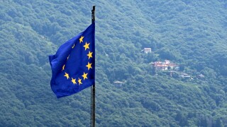 European Union Flag. Italian Alps in the background