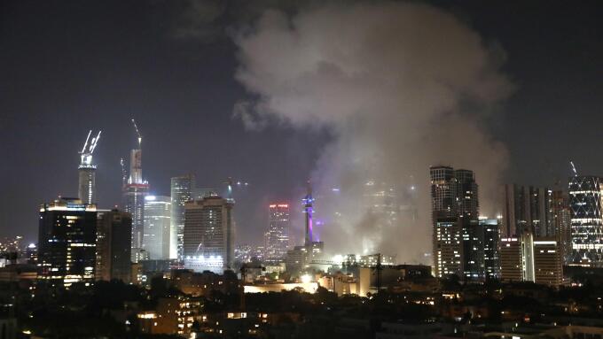 (250613) -- TEL AVIV, June 13, 2025 (Xinhua) -- Smoke rises following an Iranian missile attack in Tel Aviv, Israel, on June 13, 2025. Dozens of missiles were fired from Iran into Israel on Friday evening, according to statements issued by the Israel Defe