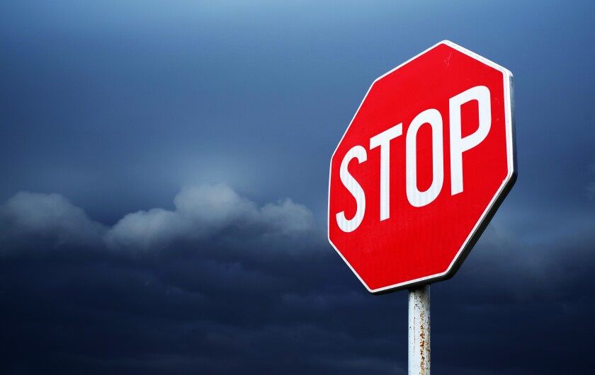 Conceptual stop sign with stormy background. Warning, caution an