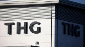 Signage is seen on a THG office building in Manchester, Britain, January 18, 2022. REUTERS/Phil Noble