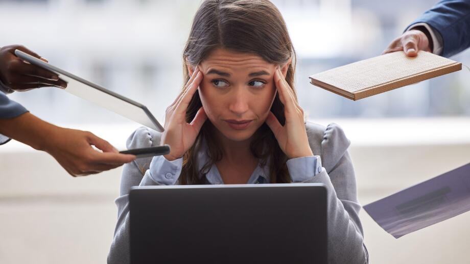 Im not coping today. Shot of a businesswoman looking overwhelmed in a demanding office environment.