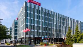 Warsaw, Poland - July 25, 2021: Millennium Park plaza known as Harmony Office Center at Bialy Kamien and Zaryna street in Mokotow residential district