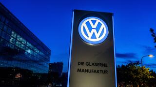 VW logo in front of Glaeserne Manufaktur, Transparent Factory, Volkswagen Factory, Auto manufacturing, Dresden, Saxony, Germany, Europe