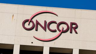 A logo sign outside of a facility occupied by Oncor Electric Delivery in Dallas, Texas on September 13, 2015.